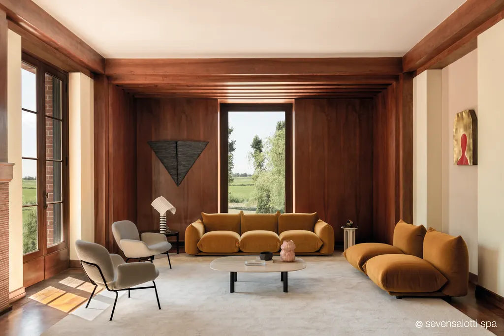 Ochre Marenco Arflex seating in a room with panelling and a window onto the countryside