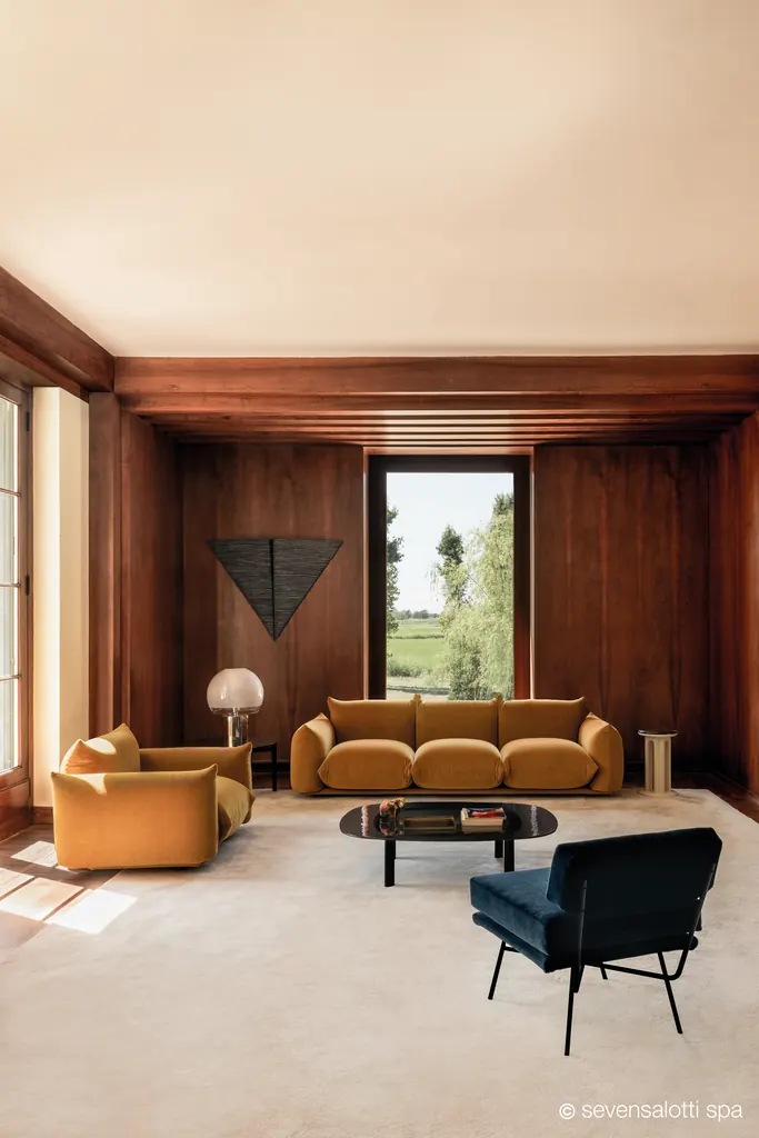 Ochre Marenco Arflex seating in a room with panelling, vertical view