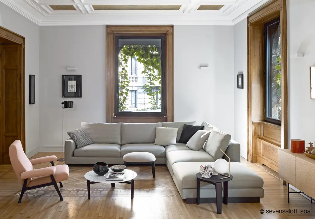Light grey Arflex Rendez-Vous corner composition in a drawing room with parquet and tall windows