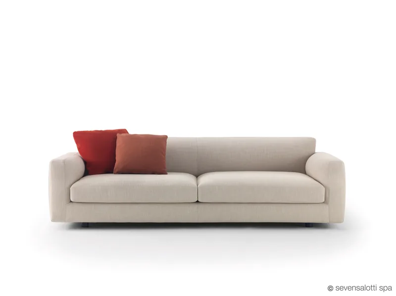 Light grey Arflex Rendez-Vous sofa with red cushions
