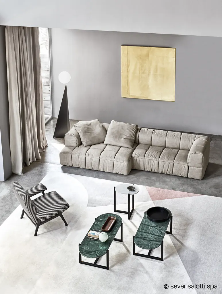 Light grey Arflex Strips sofa with green marble side tables, seen from above